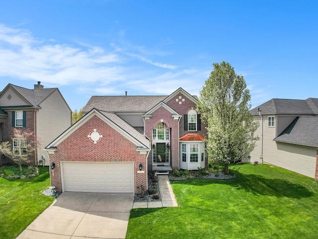 4261 Merriman Loop, Howell, MI 48843 - traditional home with brick siding, a garage, a front lawn, and driveway