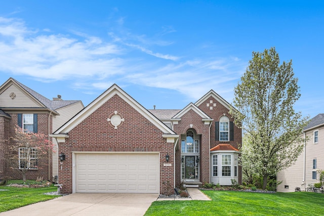 4261 Merriman Loop, Howell, MI 48843 - traditional-style house featuring driveway, an attached garage, brick siding, and a front lawn