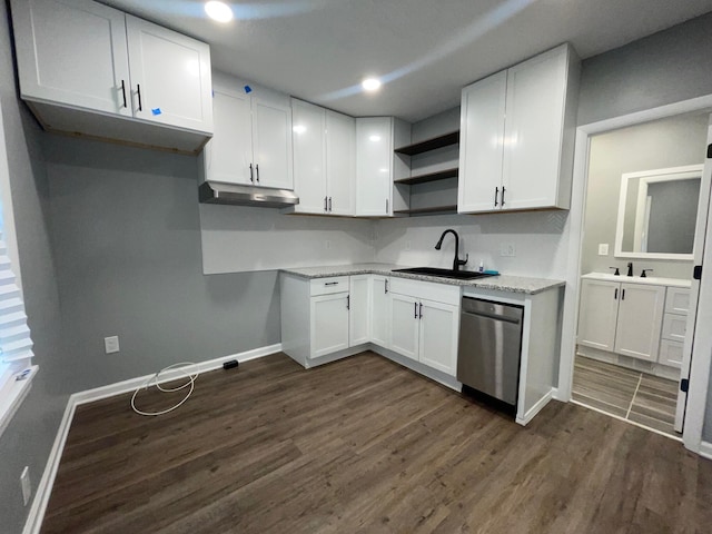 206 Mitchell St, Jackson, MI 49203 - kitchen with stainless steel dishwasher, dark wood-style flooring, open shelves, and baseboards