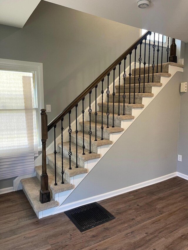 206 Mitchell St, Jackson, MI 49203 - staircase featuring wood finished floors and baseboards