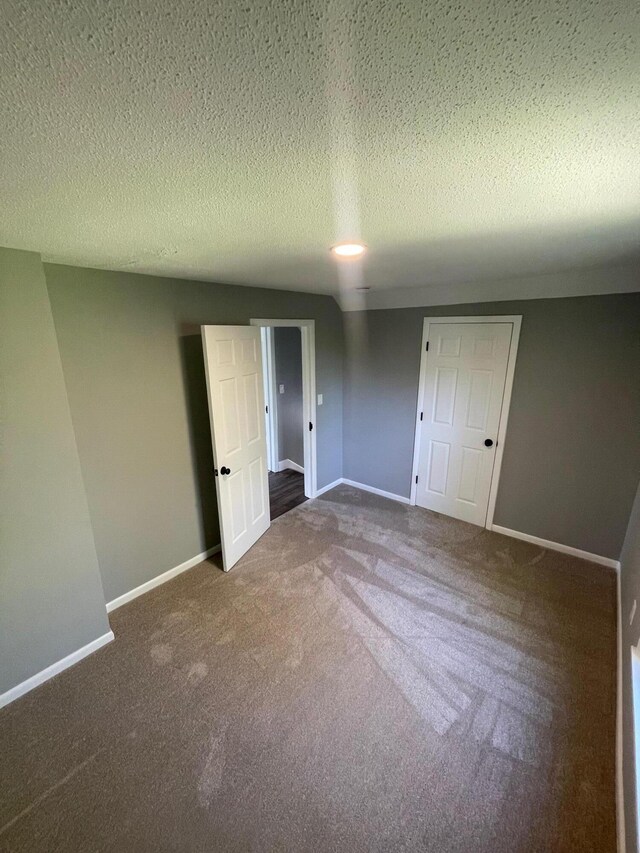 206 Mitchell St, Jackson, MI 49203 - carpeted empty room featuring a textured ceiling and baseboards