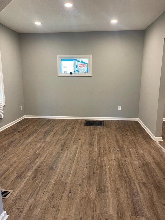 206 Mitchell St, Jackson, MI 49203 - spare room with baseboards, dark wood finished floors, and recessed lighting