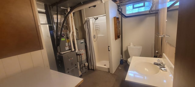 4131 W Meisenheimer Rd, Ludington, MI 49431 - bathroom featuring a sink, a stall shower, toilet, and gas water heater