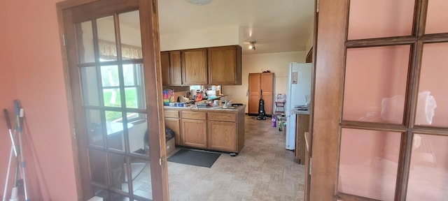 4131 W Meisenheimer Rd, Ludington, MI 49431 - kitchen with brown cabinets and light countertops