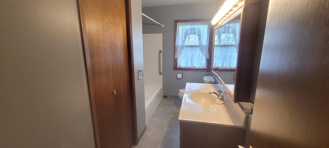 4131 W Meisenheimer Rd, Ludington, MI 49431 - full bathroom with toilet, vanity, and tub / shower combination