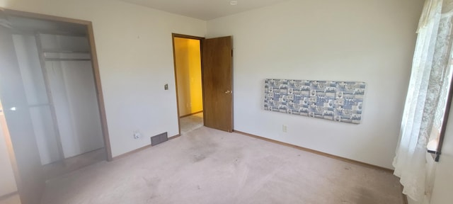 4131 W Meisenheimer Rd, Ludington, MI 49431 - unfurnished bedroom featuring carpet flooring and baseboards