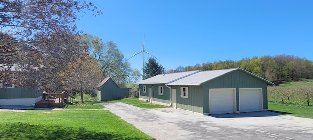 4131 W Meisenheimer Rd, Ludington, MI 49431 - view of front facade featuring a detached garage and a front yard