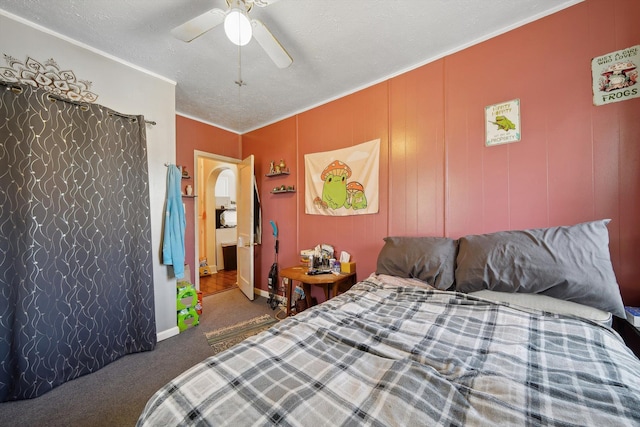 bedroom featuring carpet, a ceiling fan, crown molding, and baseboards