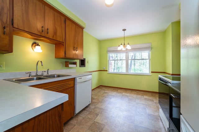 kitchen with dishwasher, a sink, range with electric cooktop, brown cabinets, and a chandelier