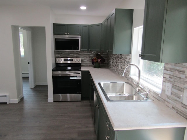 1192 Little Creek Rd SE, Alger, MI 48610 - kitchen with stainless steel electric stove, a sink, backsplash, light countertops, and recessed lighting