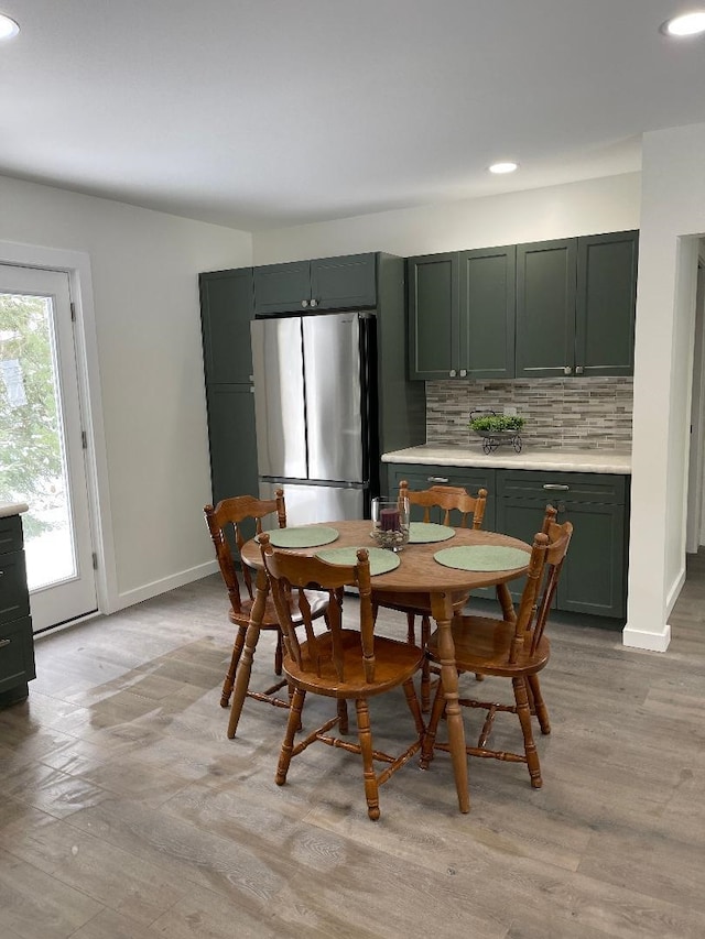 1192 Little Creek Rd SE, Alger, MI 48610 - dining area with recessed lighting, light wood finished floors, and baseboards