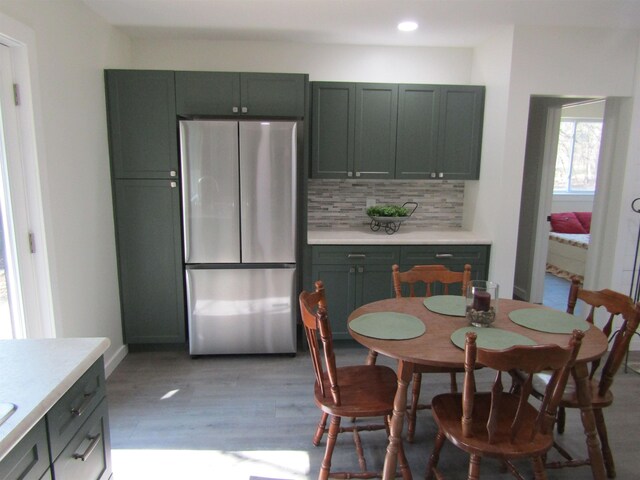 1192 Little Creek Rd SE, Alger, MI 48610 - dining room featuring light wood-type flooring, recessed lighting, and baseboards