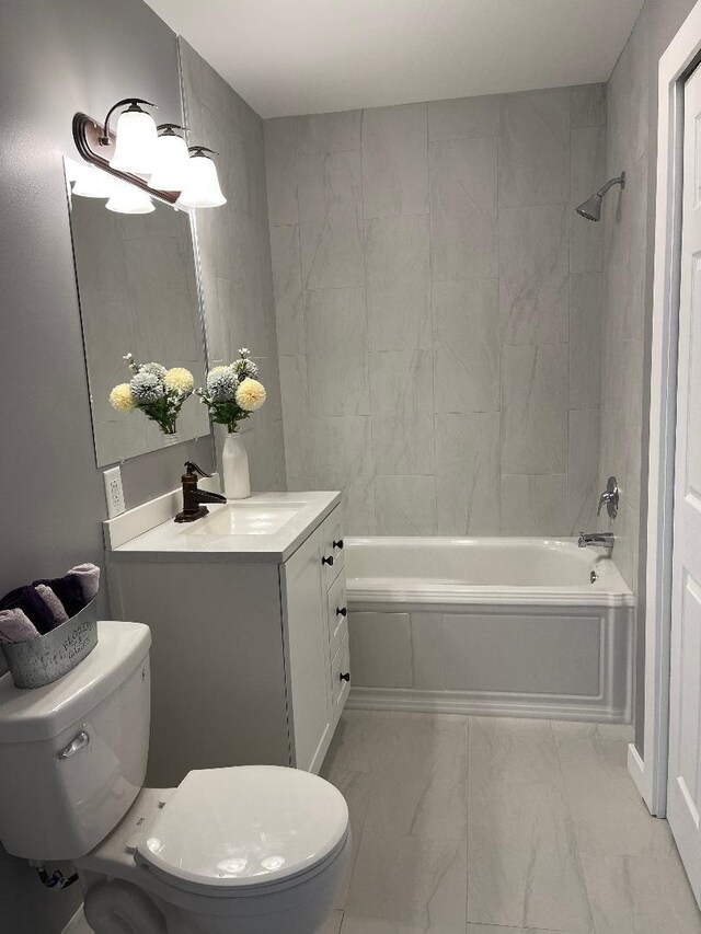 1192 Little Creek Rd SE, Alger, MI 48610 - full bathroom with toilet, shower / bath combination, marble look tile flooring, and vanity