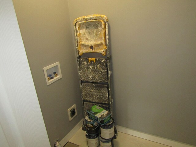 1192 Little Creek Rd SE, Alger, MI 48610 - laundry area with hookup for a washing machine and baseboards