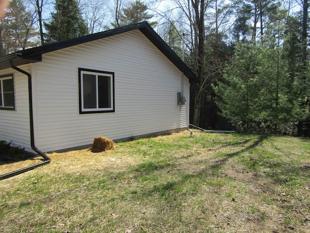 1192 Little Creek Rd SE, Alger, MI 48610 - view of side of home with a yard