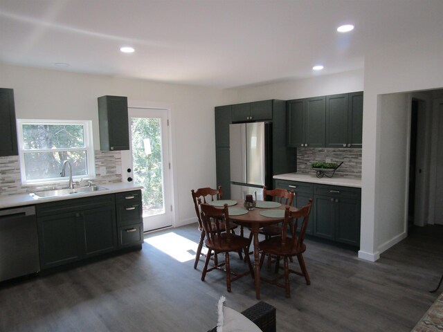 1192 Little Creek Rd SE, Alger, MI 48610 - dining area with dark wood finished floors, recessed lighting, and baseboards
