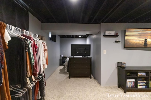 walk in closet featuring carpet