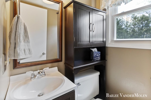 bathroom with vanity and toilet