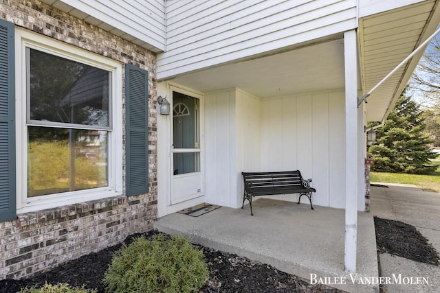 entrance to property featuring stone siding