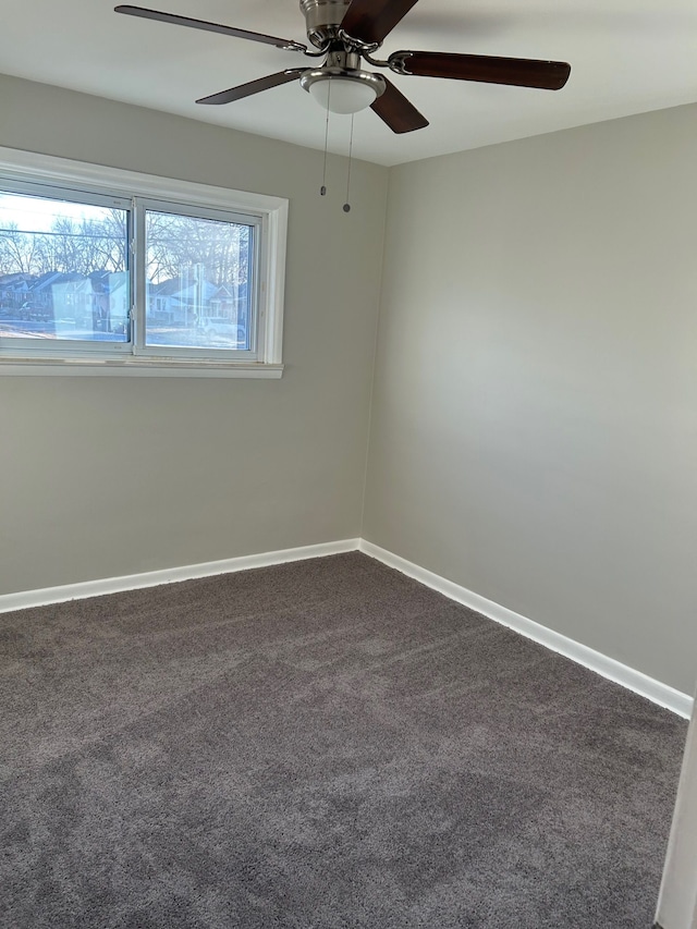 3608 W Webster Rd, Royal Oak, MI 48073 - empty room featuring dark colored carpet, a ceiling fan, and baseboards