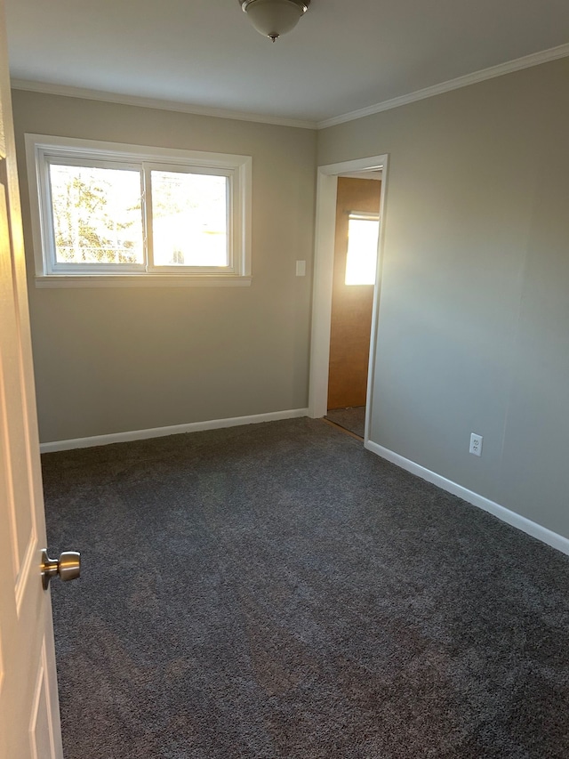 3608 W Webster Rd, Royal Oak, MI 48073 - spare room featuring ornamental molding, dark carpet, and baseboards