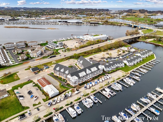 bird's eye view of a nearby body of water, a marina, and a notable bridge