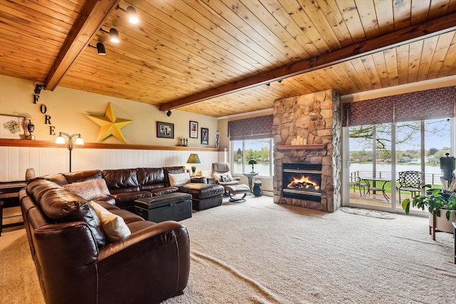 9669 Norman Rd, Clarkston, MI 48348 - carpeted living area featuring beamed ceiling, wooden ceiling, a fireplace, a water view, and track lighting