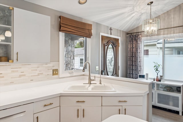 9669 Norman Rd, Clarkston, MI 48348 - full bath with tasteful backsplash, a chandelier, vanity, and vaulted ceiling