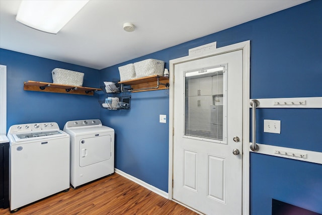 9669 Norman Rd, Clarkston, MI 48348 - washroom with washer and dryer, wood finished floors, and baseboards