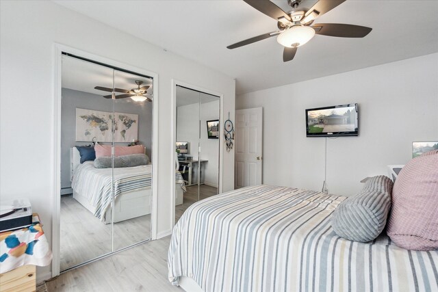9669 Norman Rd, Clarkston, MI 48348 - bedroom featuring light wood-style flooring, two closets, and a ceiling fan