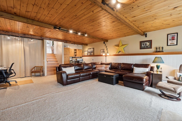 9669 Norman Rd, Clarkston, MI 48348 - carpeted living area featuring rail lighting, wainscoting, stairs, wooden ceiling, and beamed ceiling