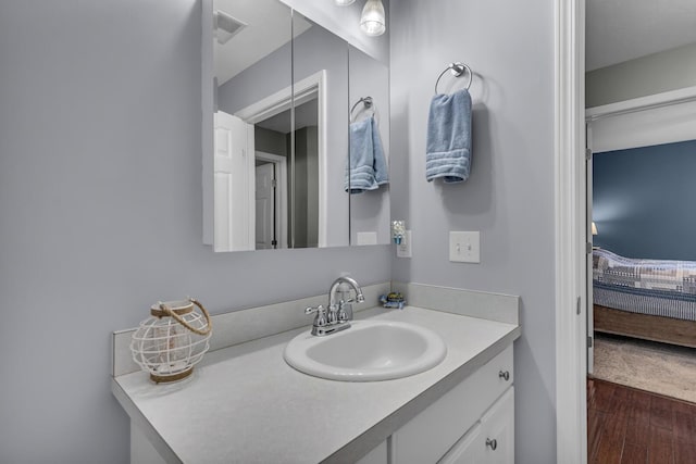 739 W Barrington Cir, Jackson, MI 49203 - bathroom with wood finished floors and vanity