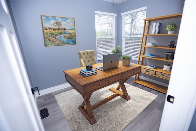 office area featuring wood finished floors and baseboards
