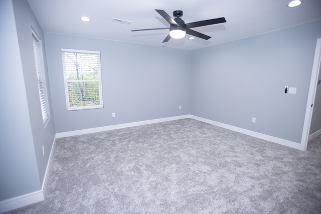empty room featuring recessed lighting, carpet floors, a ceiling fan, and baseboards