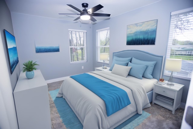 carpeted bedroom featuring a ceiling fan and baseboards