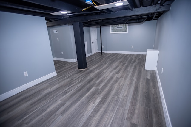 finished basement with wood finished floors and baseboards
