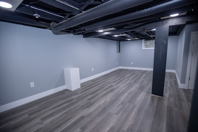 basement with wood finished floors and baseboards