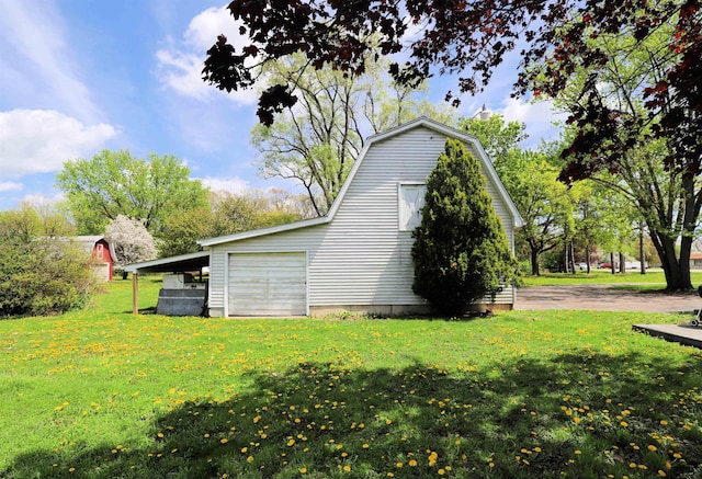 view of side of home featuring a lawn and a gambrel roof