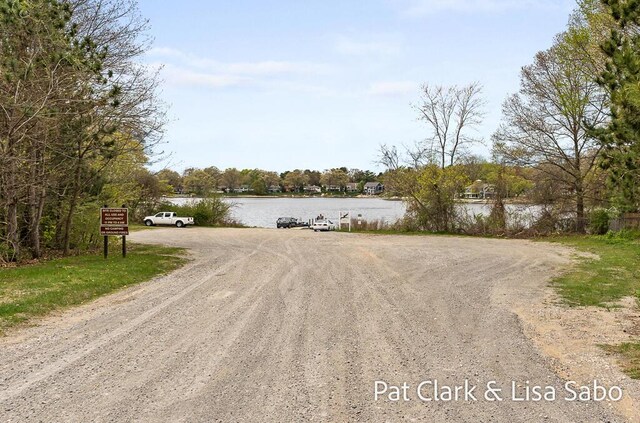 view of dirt / gravel road with a water view
