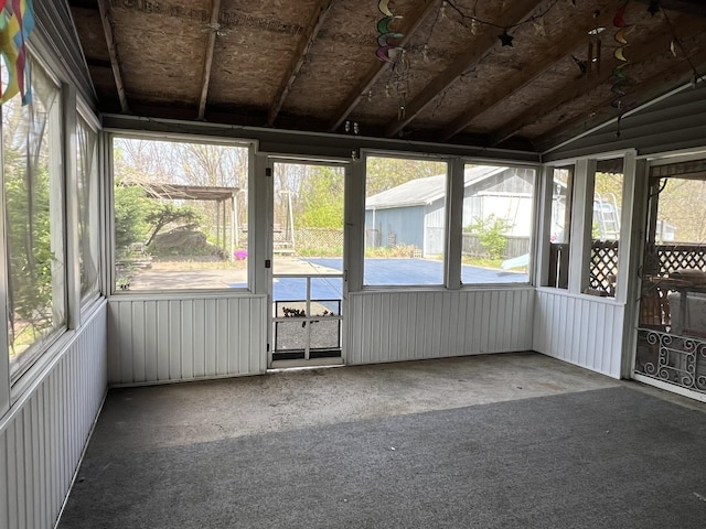 unfurnished sunroom with vaulted ceiling