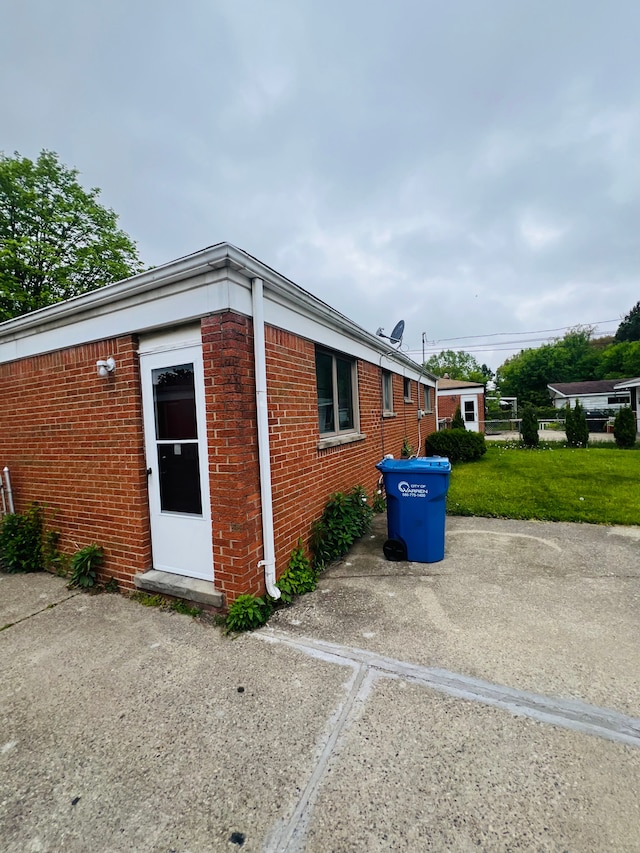 25432 Wexford Ave, Warren, MI 48091 - view of property exterior with brick siding and a yard