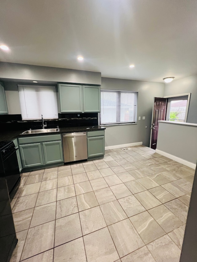 25432 Wexford Ave, Warren, MI 48091 - kitchen with stainless steel dishwasher, green cabinetry, a sink, dark countertops, and recessed lighting