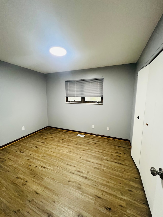25432 Wexford Ave, Warren, MI 48091 - unfurnished bedroom with wood finished floors, baseboards, and a closet