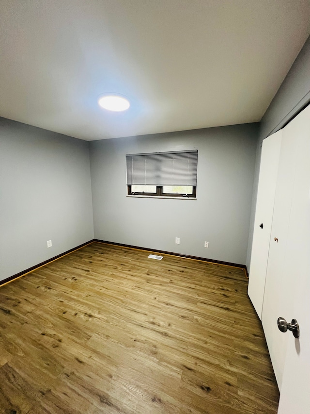 25432 Wexford Ave, Warren, MI 48091 - unfurnished bedroom featuring wood finished floors, baseboards, and a closet