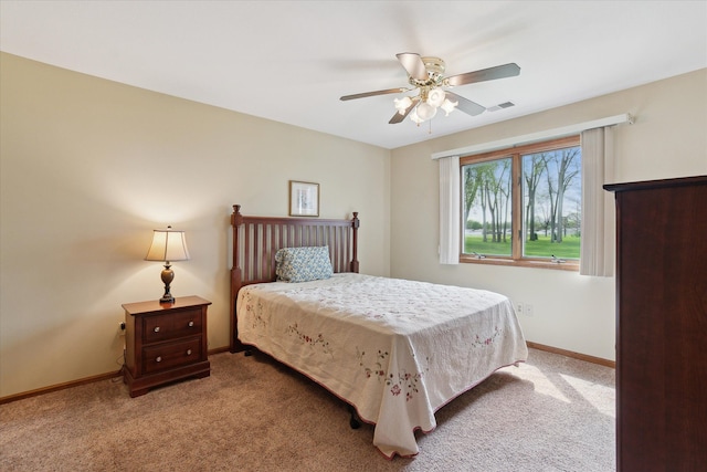 bedroom featuring carpet floors, baseboards, and a ceiling fan