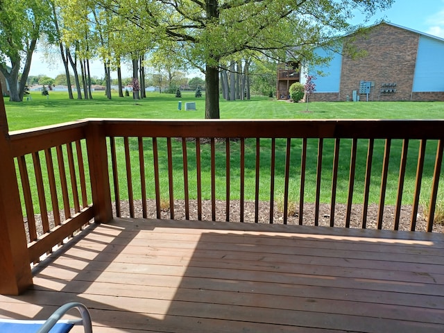 wooden terrace with a yard