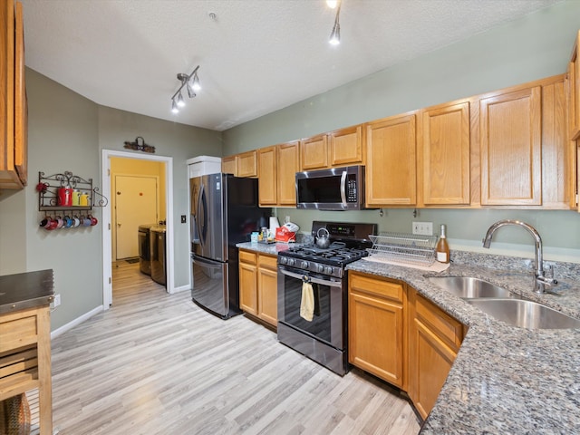 49559 Donovan Blvd, Plymouth, MI 48170 - kitchen featuring stainless steel microwave, gas stove, freestanding refrigerator, a sink, and light wood finished floors