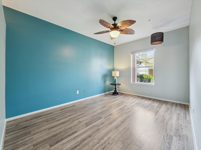 49559 Donovan Blvd, Plymouth, MI 48170 - empty room featuring wood finished floors, ceiling fan, and baseboards