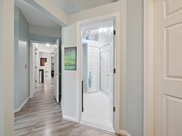 49559 Donovan Blvd, Plymouth, MI 48170 - corridor featuring light wood finished floors and baseboards