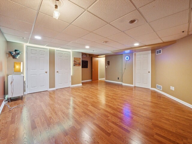 49559 Donovan Blvd, Plymouth, MI 48170 - finished below grade area featuring light wood-type flooring, a paneled ceiling, baseboards, and recessed lighting